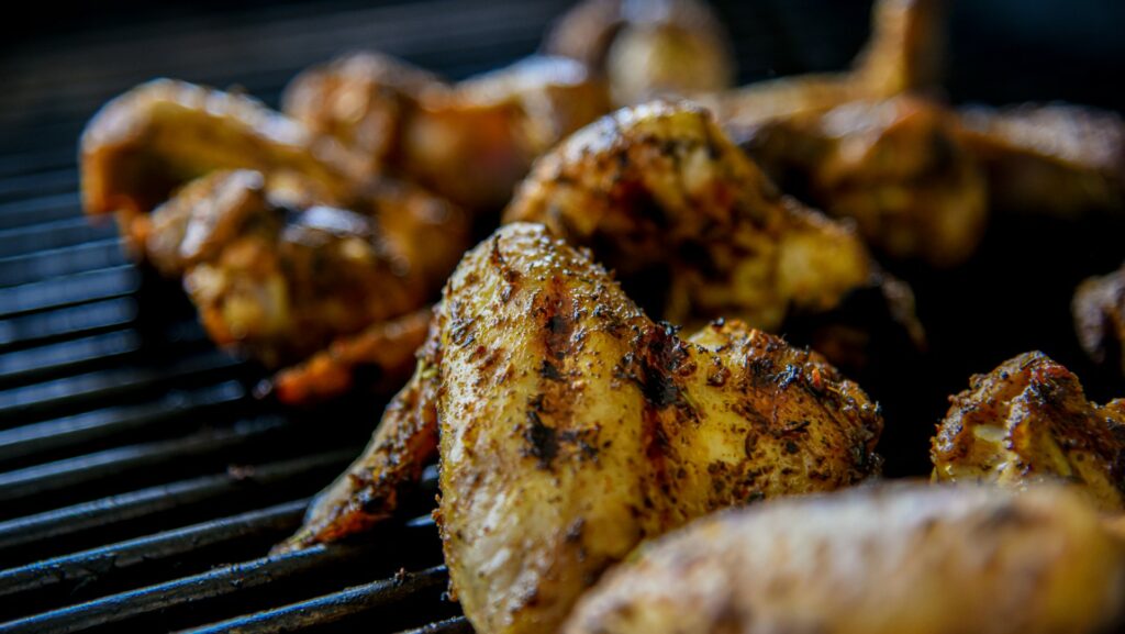 cooked chicken wings on a bbq grill