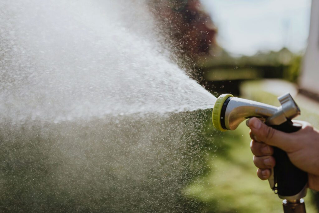 garden hose spraying water 1920 x 1080