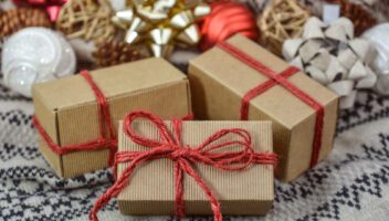 brown paper and decorative string wrapped christmas gifts